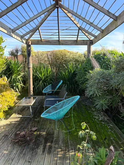 Tidied pergola deck and garden (before)