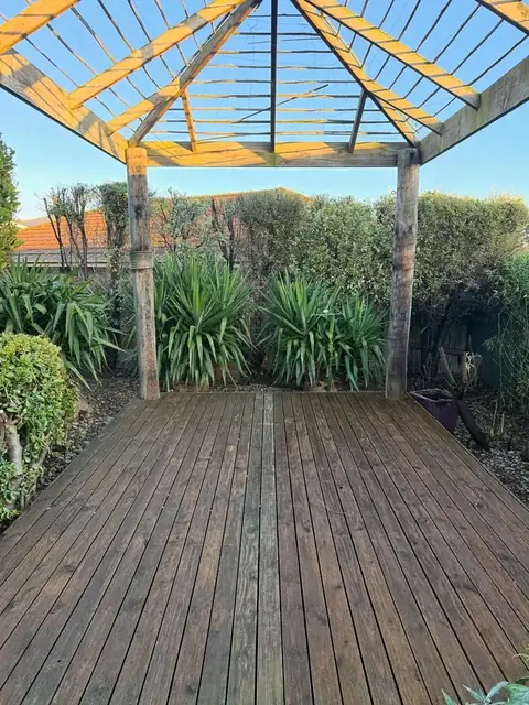 Tidied pergola deck and garden