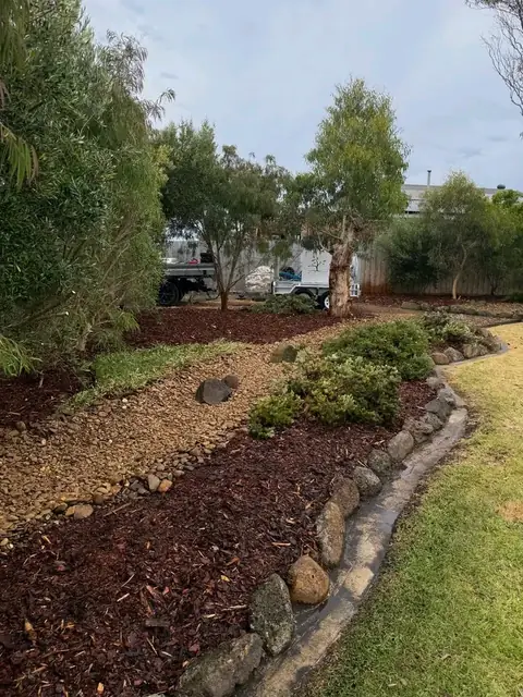 Restored garden with mulch and stone edging