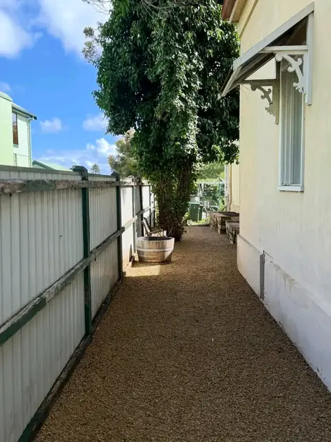 Gravel side path beside a stone-edged garden bed (2 of 3)